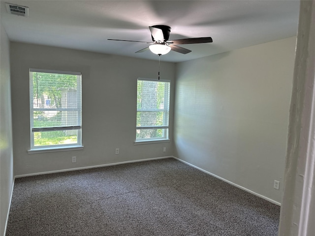 1928 Las Cruces Ln, Dallas, TX 75217 - unfurnished room featuring dark carpet, ceiling fan, baseboards, and visible vents