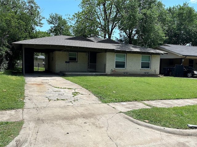 1928 Las Cruces Ln, Dallas, TX 75217 - ranch-style house with a shingled roof, a front lawn, driveway, an attached carport, and brick siding