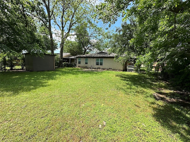 1928 Las Cruces Ln, Dallas, TX 75217 - view of yard featuring an outdoor structure and a storage shed
