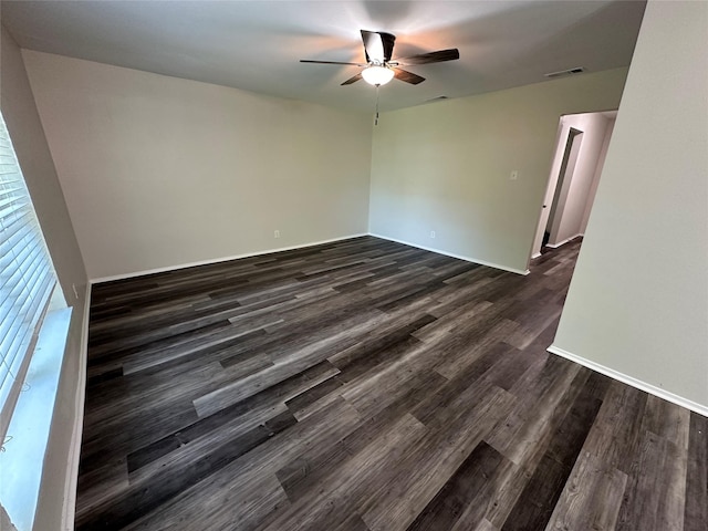 1928 Las Cruces Ln, Dallas, TX 75217 - unfurnished room with baseboards, a ceiling fan, visible vents, and dark wood finished floors