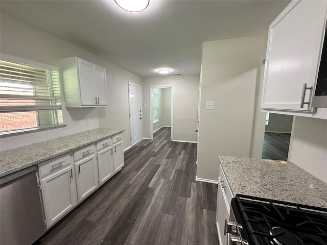 1928 Las Cruces Ln, Dallas, TX 75217 - kitchen featuring light stone countertops, stainless steel range with gas cooktop, dark wood-style floors, and white cabinetry