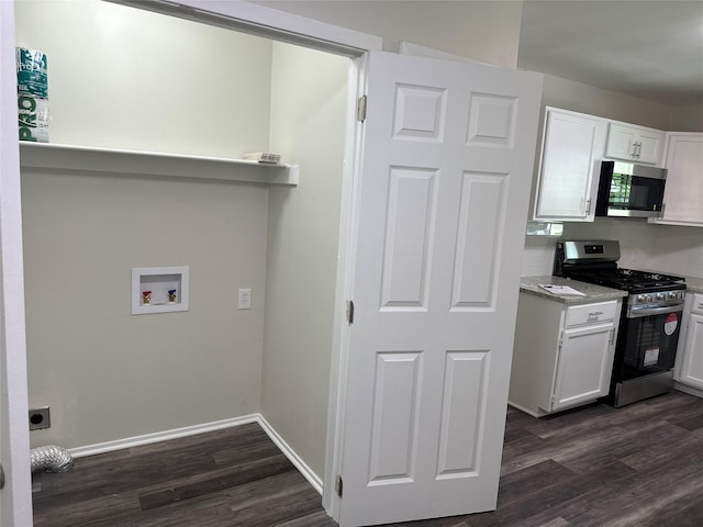 1928 Las Cruces Ln, Dallas, TX 75217 - clothes washing area with baseboards, dark wood-style floors, laundry area, and washer hookup