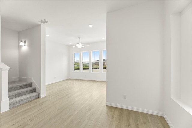 913 Janwood Dr, Plano, TX 75075 - empty room featuring ceiling fan, light wood-style flooring, baseboards, recessed lighting, and stairway