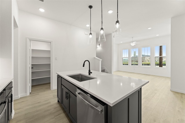 913 Janwood Dr, Plano, TX 75075 - kitchen featuring dishwasher, a sink, light countertops, light wood-style flooring, and recessed lighting