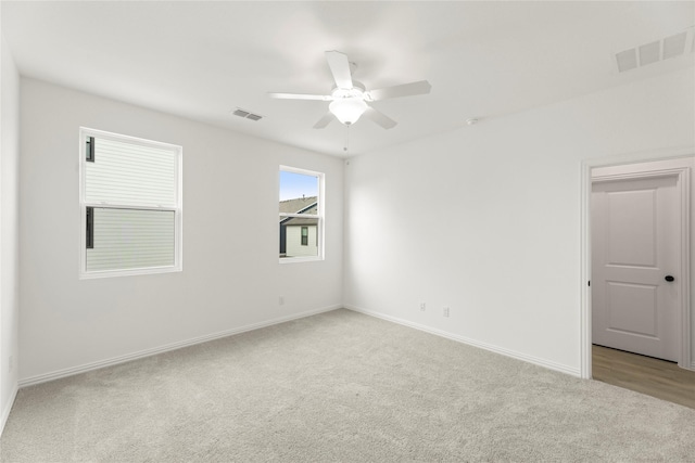 913 Janwood Dr, Plano, TX 75075 - empty room featuring light carpet, baseboards, and a ceiling fan
