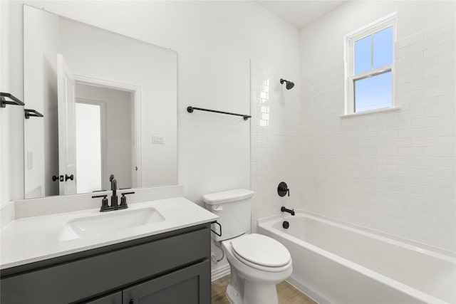913 Janwood Dr, Plano, TX 75075 - bathroom featuring toilet, vanity, bathing tub / shower combination, and wood finished floors