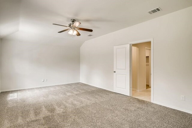 2235 Vance Dr, Forney, TX 75126 - unfurnished room featuring lofted ceiling, visible vents, a ceiling fan, and light colored carpet