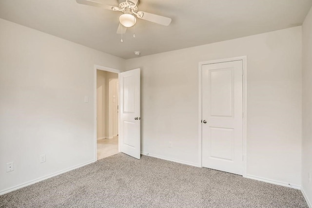 2235 Vance Dr, Forney, TX 75126 - unfurnished bedroom featuring light colored carpet, baseboards, and a ceiling fan