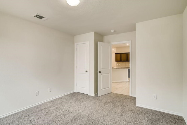 2235 Vance Dr, Forney, TX 75126 - unfurnished bedroom featuring baseboards, visible vents, and carpet flooring