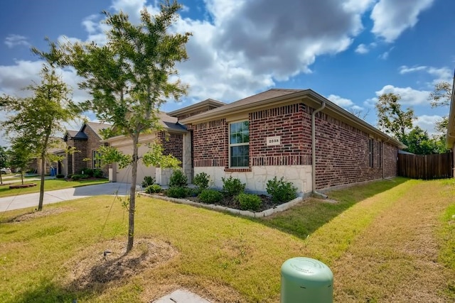 2235 Vance Dr, Forney, TX 75126 - view of property exterior with brick siding, a lawn, concrete driveway, and a garage
