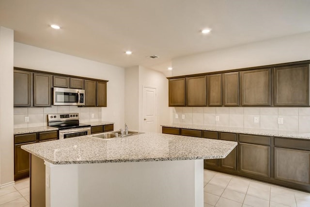 2235 Vance Dr, Forney, TX 75126 - kitchen with a sink, decorative backsplash, light tile patterned flooring, stainless steel appliances, and visible vents