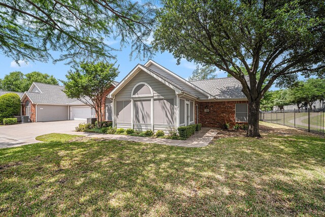 6132 Haley Ln, Fort Worth, TX 76132 - ranch-style home featuring central AC, fence, a front yard, a garage, and brick siding