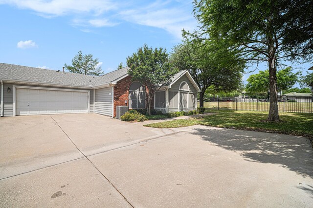 6132 Haley Ln, Fort Worth, TX 76132 - single story home featuring fence, central AC, concrete driveway, a front yard, and a garage