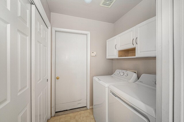 6132 Haley Ln, Fort Worth, TX 76132 - washroom featuring light floors, cabinet space, visible vents, and independent washer and dryer