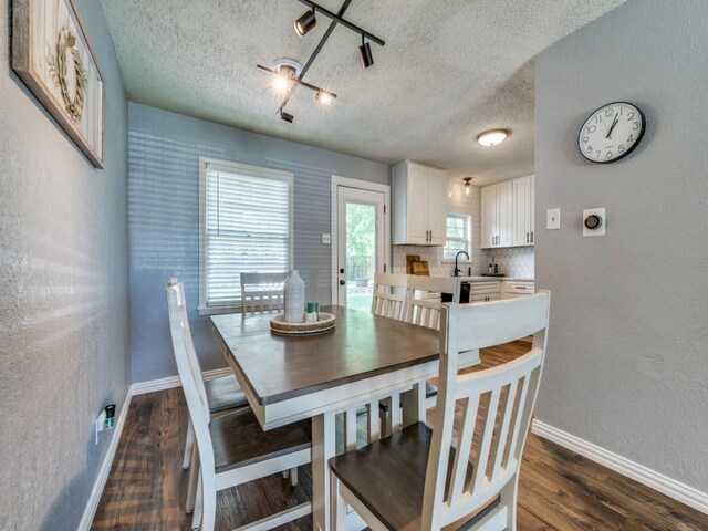 2631 Greenhurst Dr, Farmers Branch, TX 75234 - dining space with a textured ceiling, baseboards, and dark wood-style floors