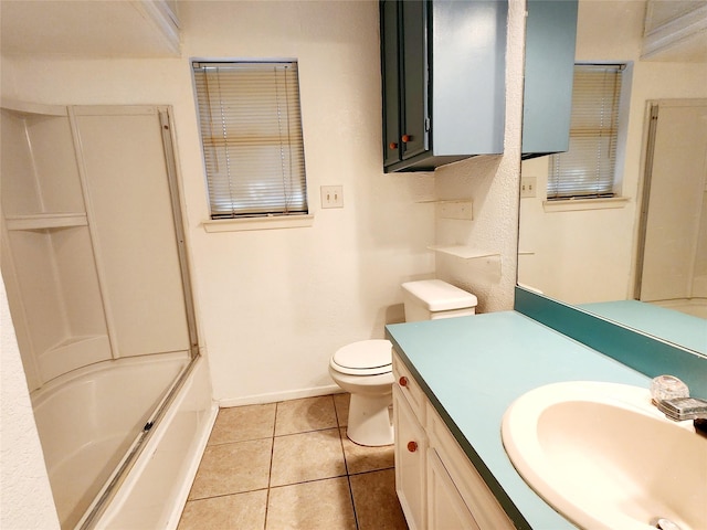 full bath featuring vanity, tub / shower combination, baseboards, toilet, and tile patterned flooring