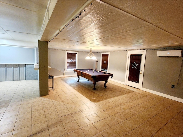 recreation room with pool table, a wall mounted AC, and light tile patterned floors