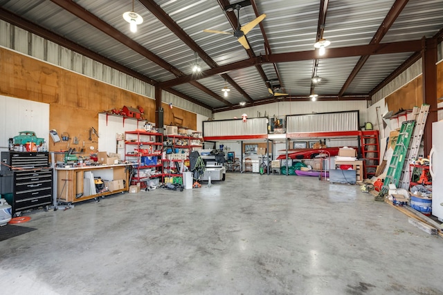 garage with metal wall and a workshop area