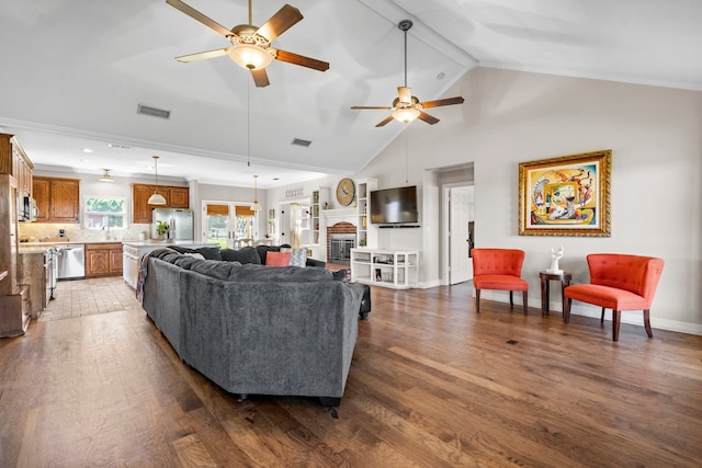 living area featuring a ceiling fan, wood finished floors, and visible vents