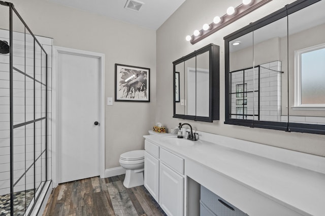 9112 Manassas Rdg, Mckinney, TX 75071 - full bath with a shower stall, toilet, wood finished floors, and vanity