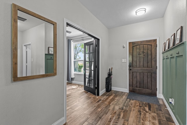 9112 Manassas Rdg, Mckinney, TX 75071 - foyer with wood finished floors and baseboards