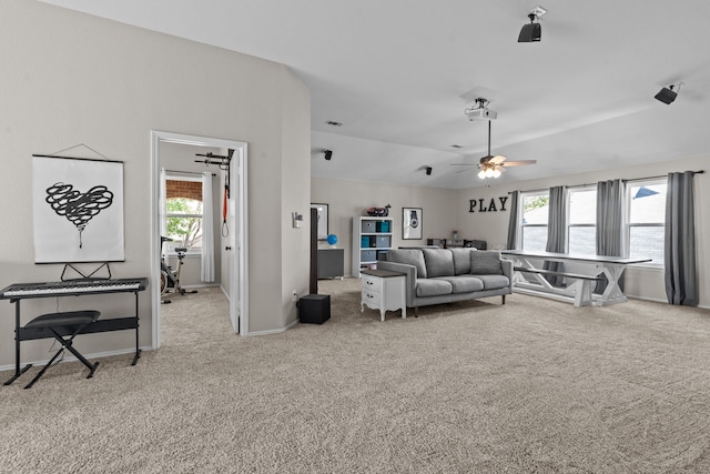 9112 Manassas Rdg, Mckinney, TX 75071 - carpeted living room featuring plenty of natural light, a ceiling fan, baseboards, and lofted ceiling
