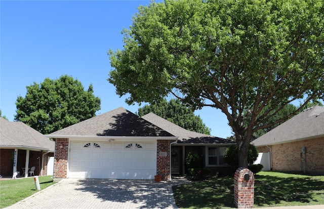 103 Sunglow Loop, Red Oak, TX 75154 - ranch-style home featuring brick siding, driveway, a front yard, and a garage