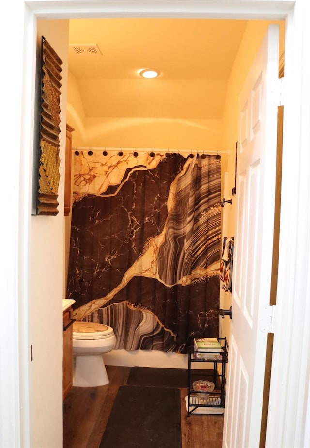 103 Sunglow Loop, Red Oak, TX 75154 - bathroom featuring wood finished floors, visible vents, a shower with shower curtain, and toilet