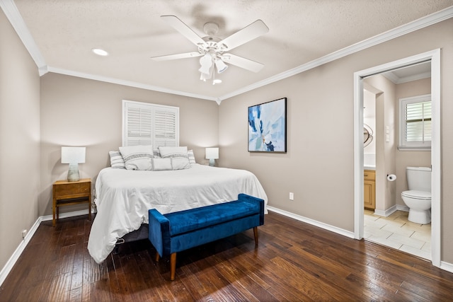 bedroom featuring wood-type flooring, baseboards, and ensuite bathroom