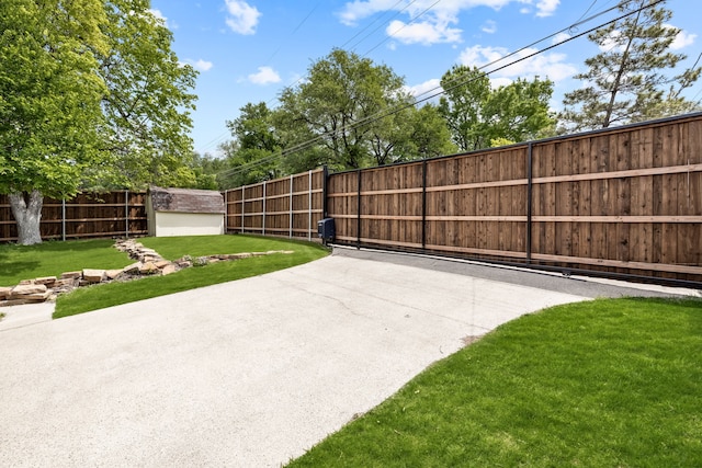 view of patio featuring an outdoor structure and fence