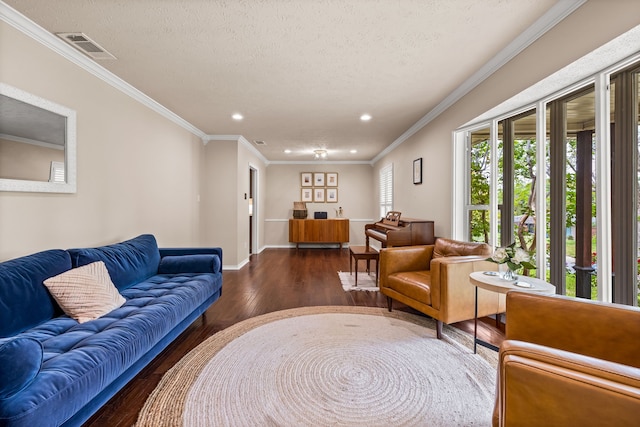 living room featuring baseboards, ornamental molding, dark wood-type flooring, visible vents, and recessed lighting