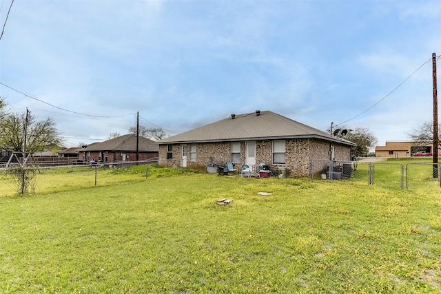 2545 E Renfro St, Burleson, TX 76028 - back of house with a lawn, a fenced backyard, and brick siding