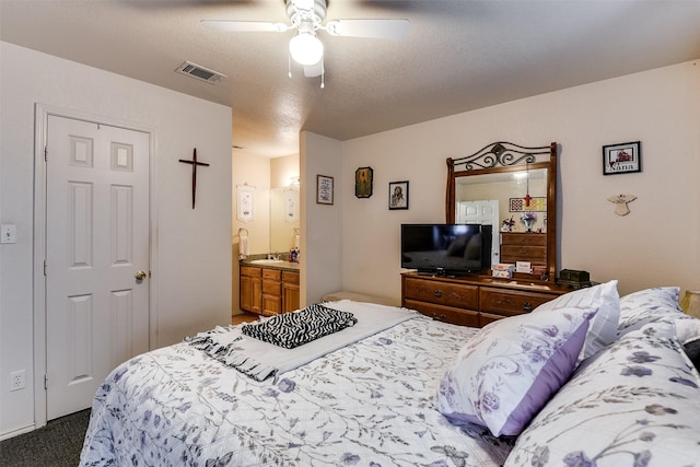 2545 E Renfro St, Burleson, TX 76028 - carpeted bedroom with a ceiling fan, ensuite bathroom, and visible vents