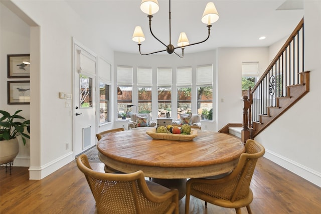 dining area featuring a wealth of natural light, wood finished floors, and baseboards