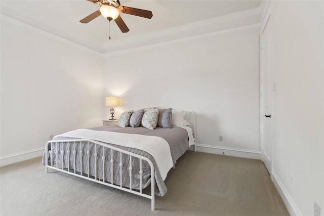 carpeted bedroom featuring ceiling fan and baseboards