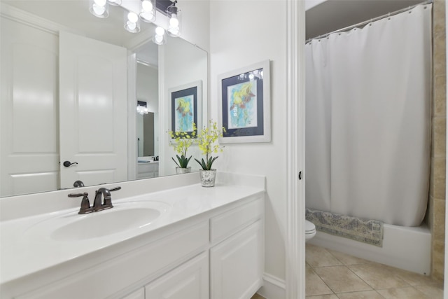full bathroom with tile patterned floors, toilet, and vanity