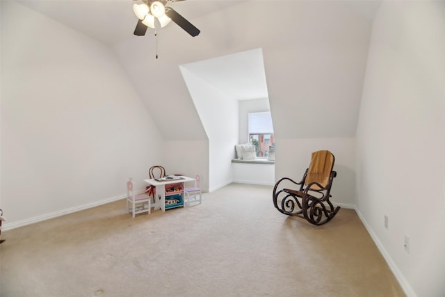 playroom featuring a ceiling fan, vaulted ceiling, and carpet floors