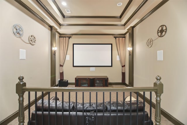 home theater featuring visible vents, baseboards, and crown molding