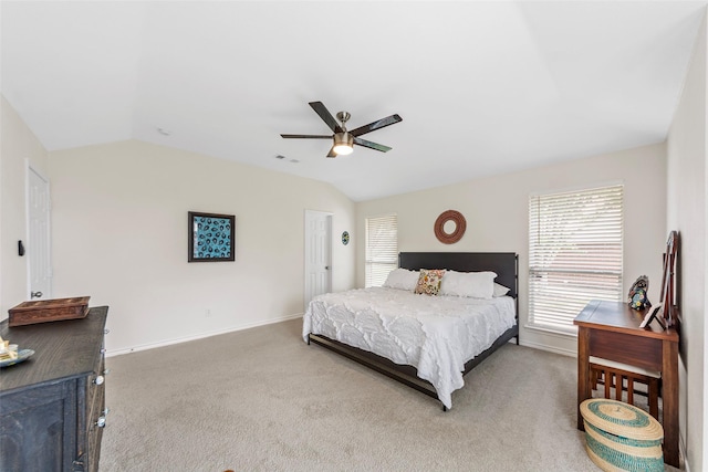 bedroom with vaulted ceiling, visible vents, and carpet floors