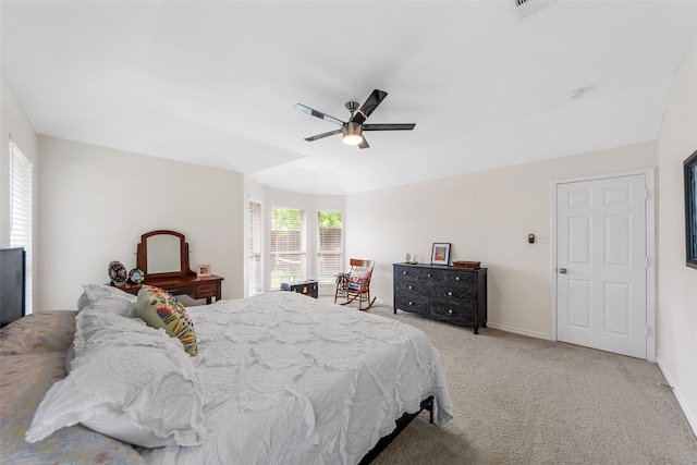 bedroom with light colored carpet, ceiling fan, and baseboards