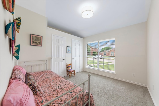 bedroom featuring baseboards and carpet floors