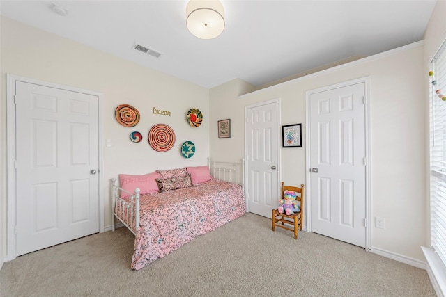 carpeted bedroom with visible vents