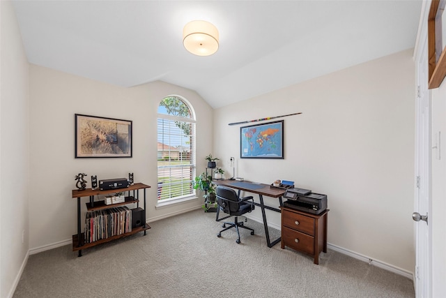 office area featuring vaulted ceiling, baseboards, and carpet flooring