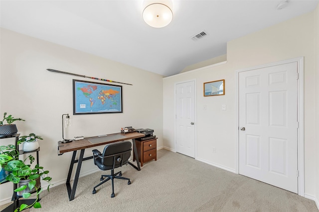 home office featuring lofted ceiling, baseboards, visible vents, and carpet floors