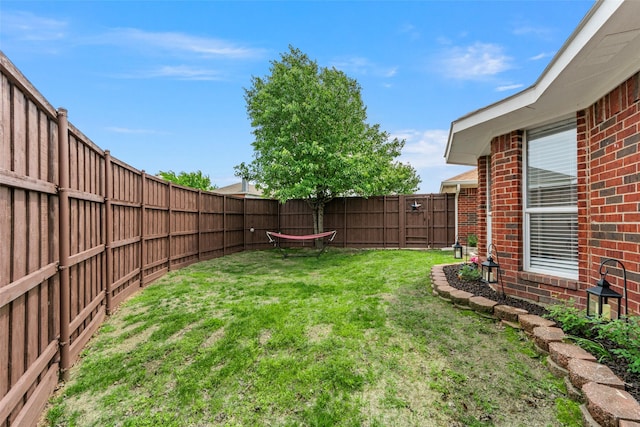 view of yard featuring a fenced backyard