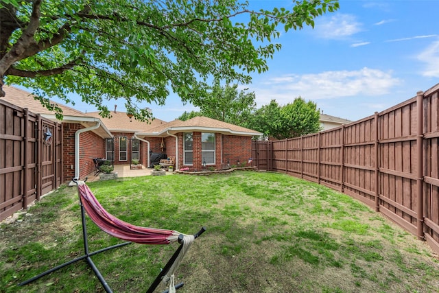 view of yard with a fenced backyard