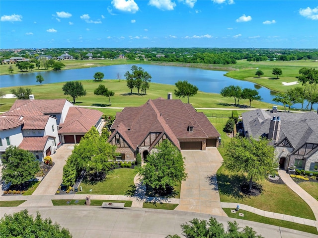 birds eye view of property featuring golf course view, a water view, and a residential view