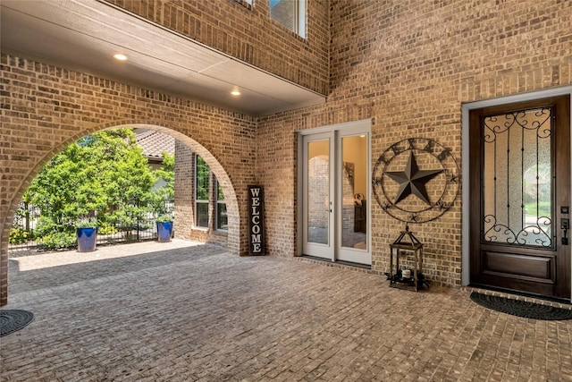 exterior space featuring brick siding