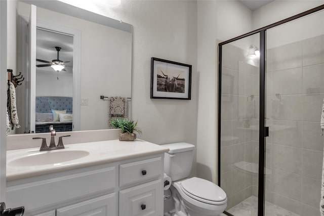 ensuite bathroom with ensuite bath, toilet, a shower stall, ceiling fan, and vanity