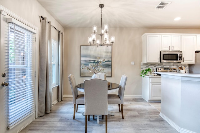 8741 Bigelow Dr, Plano, TX 75024 - dining room with a chandelier, light wood-type flooring, baseboards, and recessed lighting